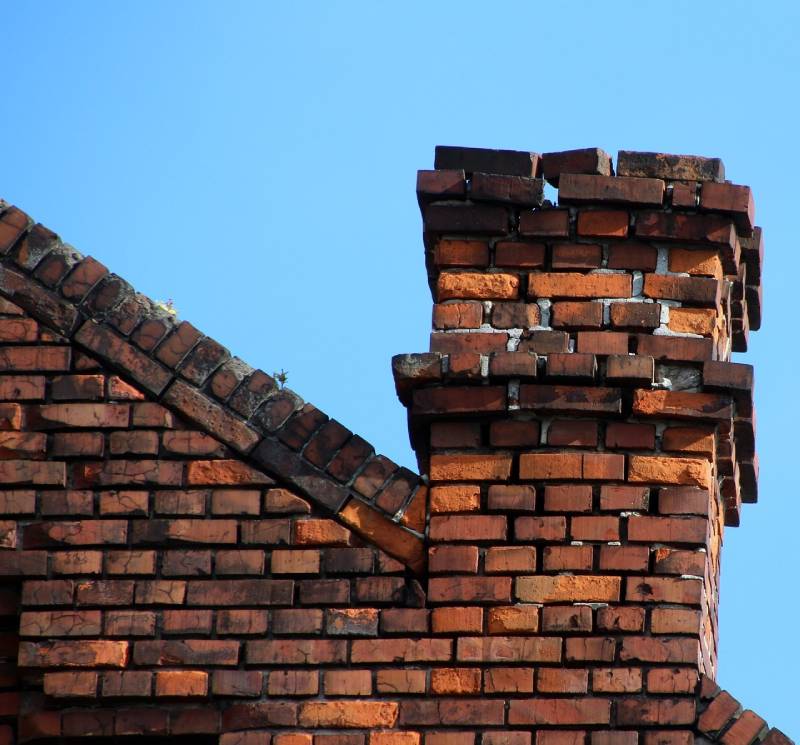 Damaged chimney on an Finksburg home showing cracks and missing mortar